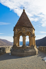 Fototapeta na wymiar Georgia, the bell tower of the Ananuri Fortress on the Georgian Military Road overlooking the lake