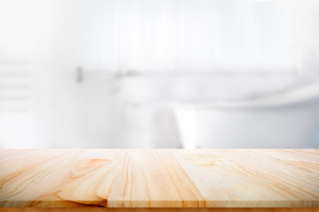Empty wooden top table with blurred bathroom background.