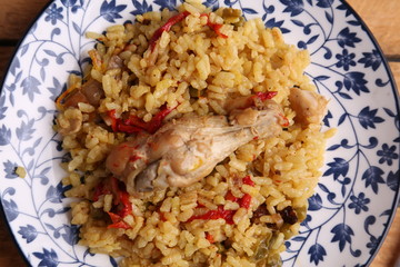 plate of rice with chicken and peppers