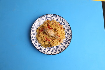 plate of rice with chicken and peppers