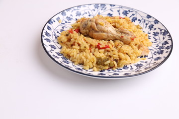 plate of rice with chicken and peppers