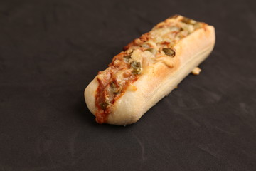 hot dog with cheese and pepper