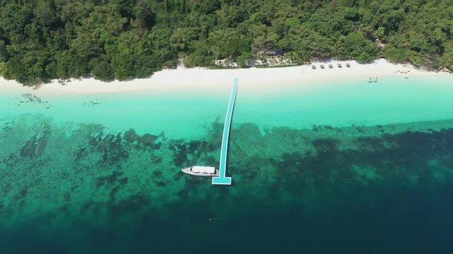 Footage B-roll of Aerial view ocean waves, beach and rocky coastline and beautiful forest. Nyaung Oo Phee Island Myanmar Tropical seas and islands in southern Myanmar. Beautiful tourist attractions.