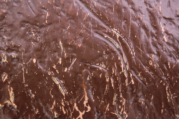 Old brown paint on the wall for background. Bursts, cracks, scratches, abrasions.