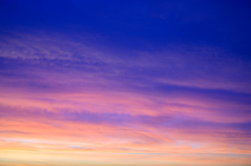 Fototapeta premium Photo of a dark sky in the early autumn morning with colorful clouds