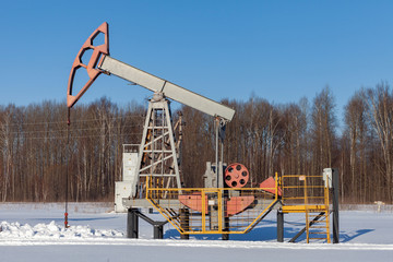 Oil pump in winter. Oil production in the North