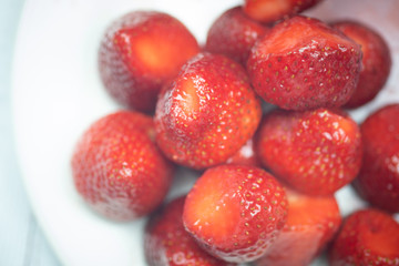 Fresh strawberries on a white plate