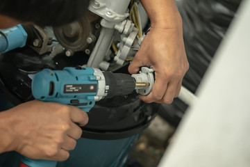Worker use electric hammer drill