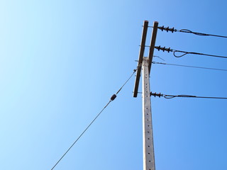 Guy Wire and high voltage cable on the pole It is a cable for fixing the tension of the post and...