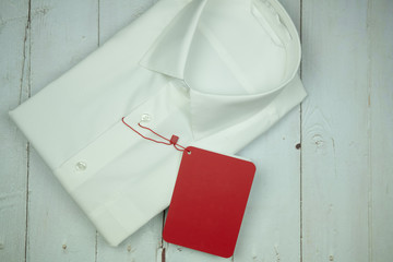 White formal shirt with red sale tag