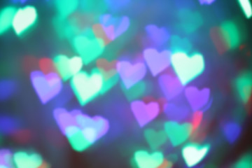 Blurry colored lights in the shape of hearts background