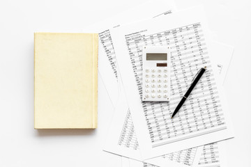 Financial literature. Books near documents, calculator on white background top-down