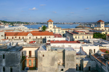 Havana, Cuba - November 13 2006: Cityscape view of Plaza de San Francisco de Asis and other old buildings near the port in Havana