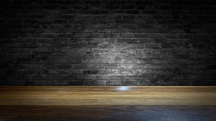 background of an empty black room, a cellar, lit by a searchlight. Brick black wall and wooden floor