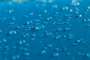  Water droplets on a  waterproof fabric blue background
