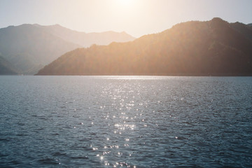 the concept of boating, recreation, travel - splashes of blue water in the river, mountains, sky....