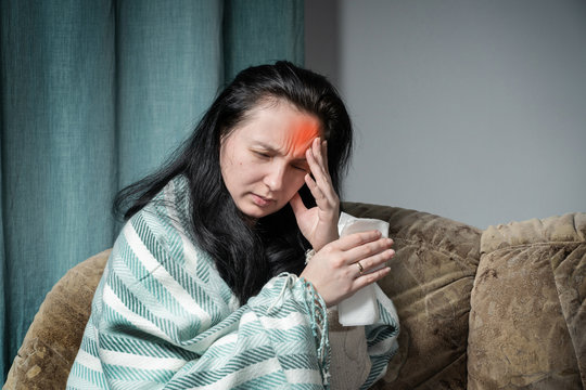 Woman Holds Her Hand Over Her Head. Headaches In Woman