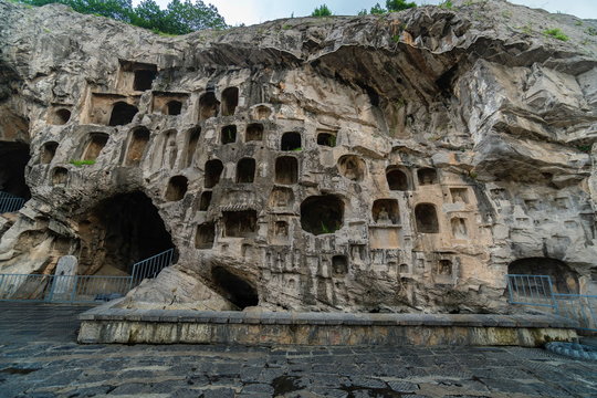 Caves on west hill limestone cliff. Longmen Grottoes Luoyang, Henan province, China
