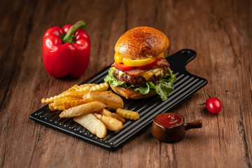 Fresh home-made hamburger served on wood