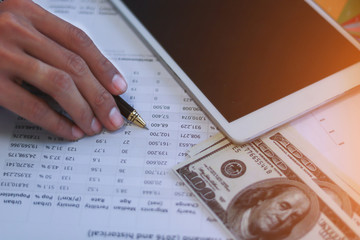 Businessman with cash dollars - business concept,tablet and finance,investment,save,success and profitable business concepts.