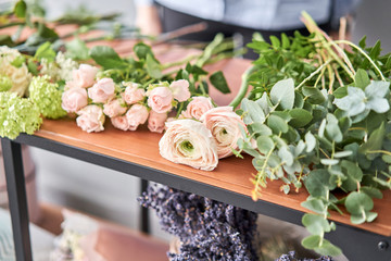Education in the school of floristry. Master class on making bouquets. Summer bouquet. Learning...