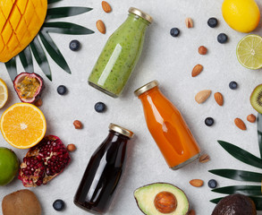 Assortment of fruit and vegetables smoothies in glass bottles. Superfoods and health or detox diet food concept. Fresh vitamins, breakfast drink.