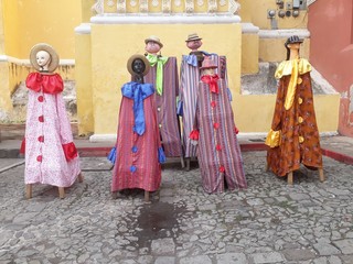 Naklejka premium Antigua traditional dress of Guatemala on dummies, manikins, statues outside in the square for Independence day. Central America dress and clothes.