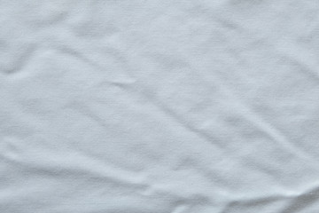 Wrinkled White fabric close up shot of good quality Cotton and polyester shirt. formal wear for office worker . Background texture concept with copy space for text.