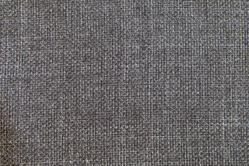 Fototapeta na wymiar Selective focus, Close up shot of dark grey formal suit cloth textile surface. wool fabric texture for important luxury evening or night event. Wallpaper and background with copy space for text