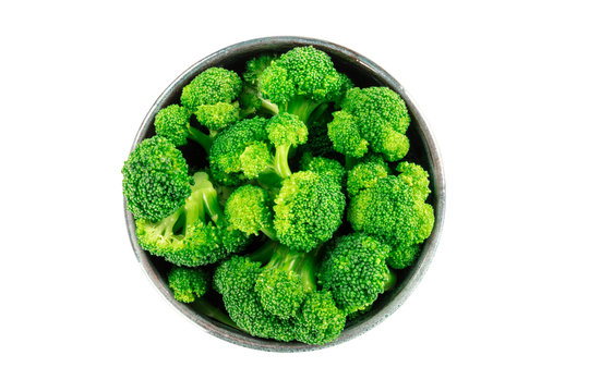 A Bowl Of Cooked Broccoli, Isolated On A White Background With A Clipping Path, Shot From The Top