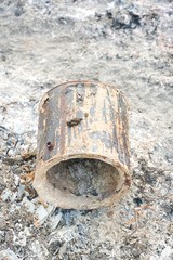 close up old rusty can on the ground