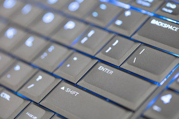 Close up led backlit computer laptop keyboard