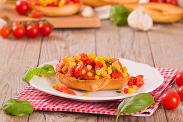 Friselle with tomatoes and mais.