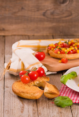 Friselle with tomatoes and mais.