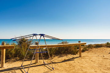 Fototapeta premium Camping on beach, empty clotheshorse