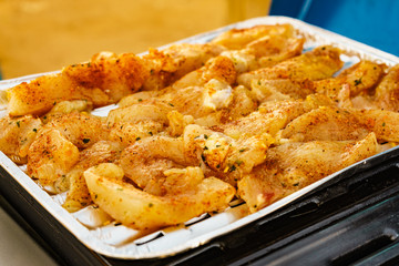 Chicken meat grilling on gas grill