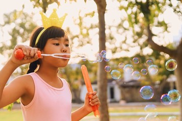 boy playing with soap bubbles