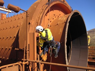 Closeup pictures of rope access  industrial inspector fitters, boilermaker wearing safety harness...