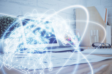 Multi exposure of business theme icons and work space with computer background. Concept of success.