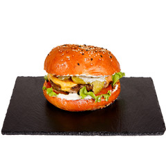 Tasty Burger on a plate in cafe.