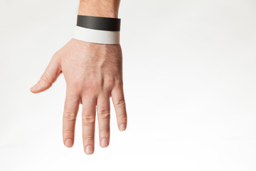 Black and white version of blank bracelet on hand. Paper festival branding wristband, mockup.