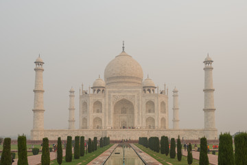 Fototapeta na wymiar Front side of the Taj Mahal in Agra, India, on overcast morning with smog