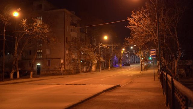 Simferopol empty city streets with street lights at night in autumn.