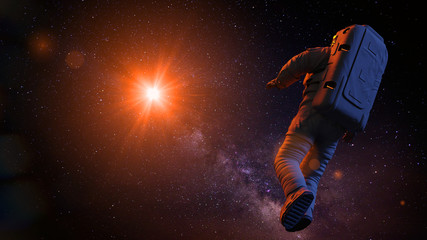 astronaut in outer space flying towards a star © dottedyeti