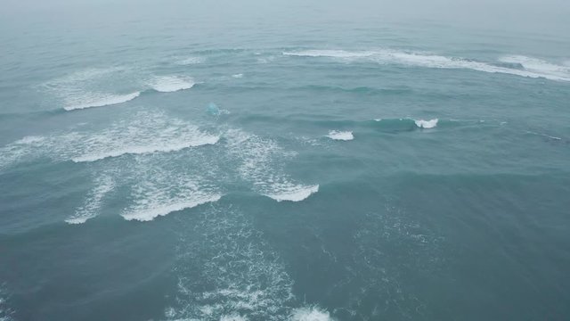 Drone shot of waves near diamond beach, Iceland