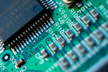 Close up macro shooting computer circuit mainboard integrated elements. Shallow depth of field....