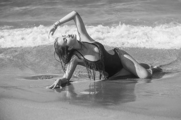 Travelling and adventure concept. Sea view, girl rest at sea store. Pretty american or european woman in swimwear