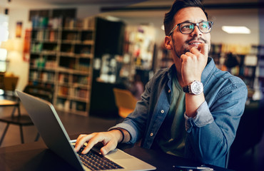 Happy man working on laptop. Technology people work study concept