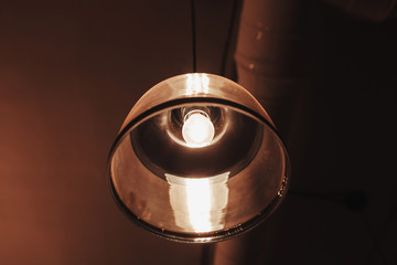 Close up vintage lamp in cafe at night for background