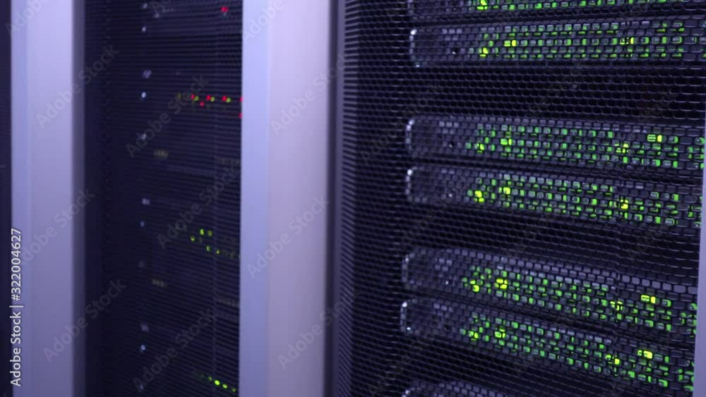 Poster servers racks close up in datacenter server room. motion camera.